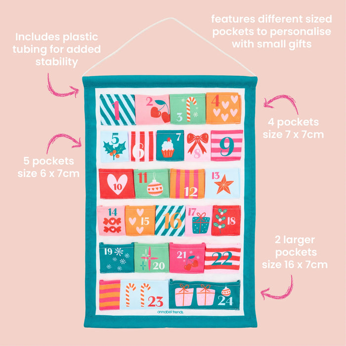 Fabric Christmas Advent Calendar hanging on a wall styled with festive decorations
