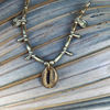 Cowrie Brass Beaded Necklace - styled shot | Travel & Tide