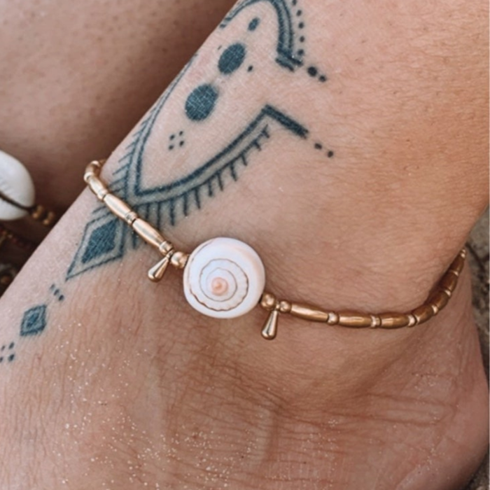 Handmade puka shell anklet with brass beads and droplets on waxed cord, adjustable bohemian beach jewellery