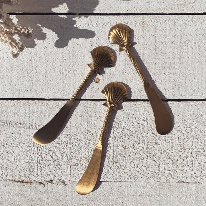 Gold Clam Shell Spreader - styled shot | Travel & Tide