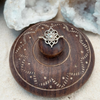 Sterling silver mandala ring with intricate geometric design worn on hand showing adjustable fit