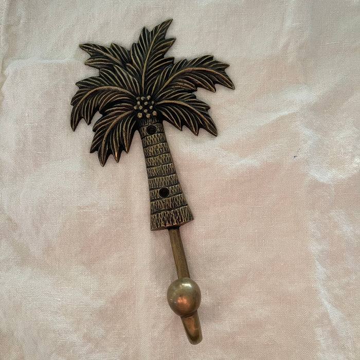 Antique brass coconut palm hook large size showing full palm tree detail with coconut clusters and textured trunk
