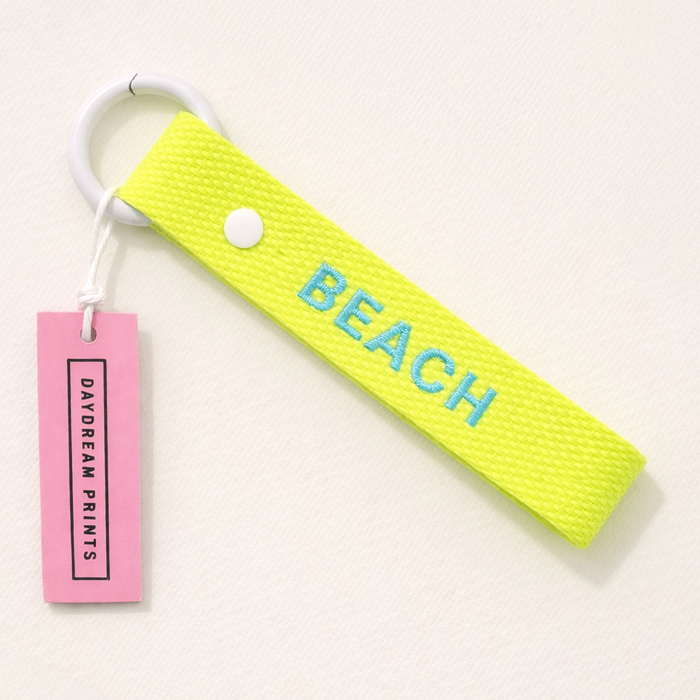 BEACH embroidered webbing keychain in neon yellow and blue with sturdy snap closure — coastal summer accessory by Daydream Prints

