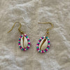 Beaded cowrie shell earrings with pink and blue seed beads on gold hooks
