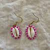 Handmade beaded cowrie shell earrings with fuchsia and pink seed beads on gold hooks
