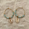 Blue and grey polymer clay bead hoop earrings with natural cowrie shell drop and gold-tone accents
