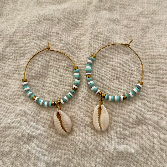 Blue and grey polymer clay bead hoop earrings with natural cowrie shell drop and gold-tone accents
