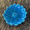 Blue glazed ceramic lotus incense holder, overhead view showing rounded petal layers and central incense hole

