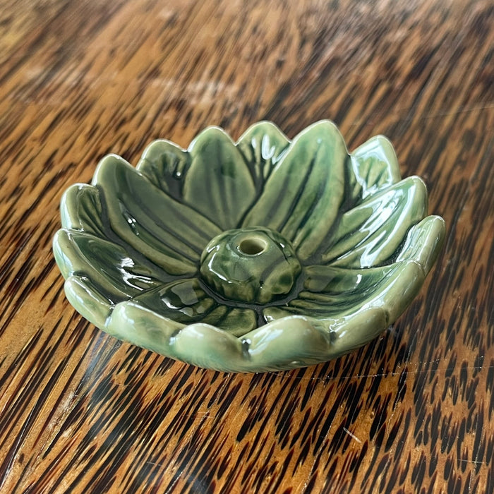 Green glazed ceramic lotus flower incense holder, angled view showing deep sage green glaze and layered petal detail
