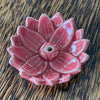 Red glazed ceramic lotus incense holder, overhead view showing full bloom petal arrangement and central incense hole
