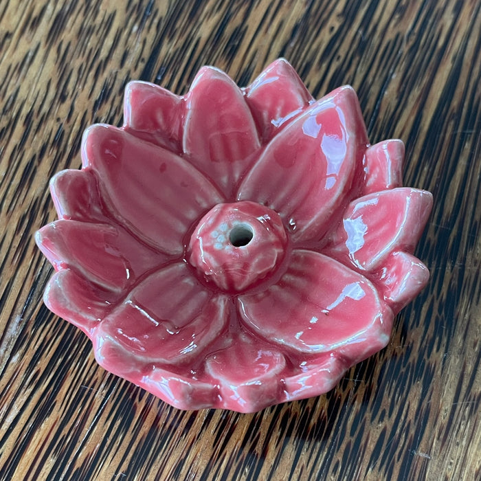 Red glazed ceramic lotus incense holder, overhead view showing full bloom petal arrangement and central incense hole
