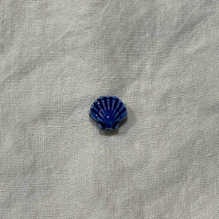Cobalt blue ceramic scallop shell bead on white linen - Travel and Tide Coastal Notions
