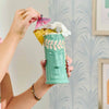 Tiki cocktail cup in ceramic with glossy glaze and embossed tropical design
