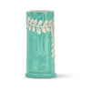 Close-up of embossed tropical design on ceramic Tiki cocktail cup
