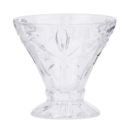 Set of 4 clear etched palm tree cocktail glasses on a styled table
