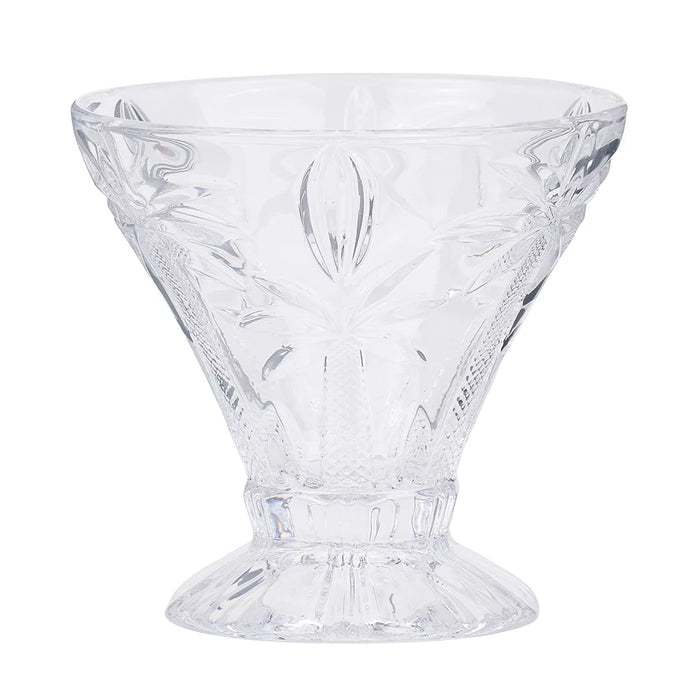 Set of 4 clear etched palm tree cocktail glasses on a styled table
