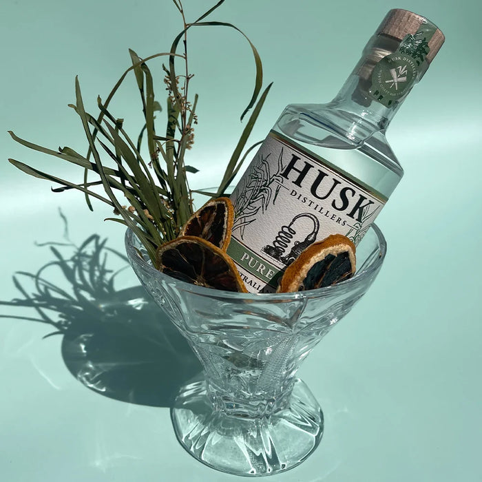 Palm etched cocktail glasses in Clear, Amber and Blue styled together for summer outdoor entertaining
