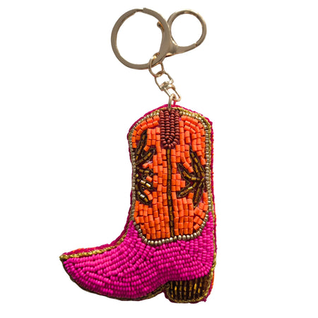 Cowgirl boot beaded keychain with a hot-pink foot, orange shaft, bronze-coloured detailing and a gold-tone keyring and clasp
