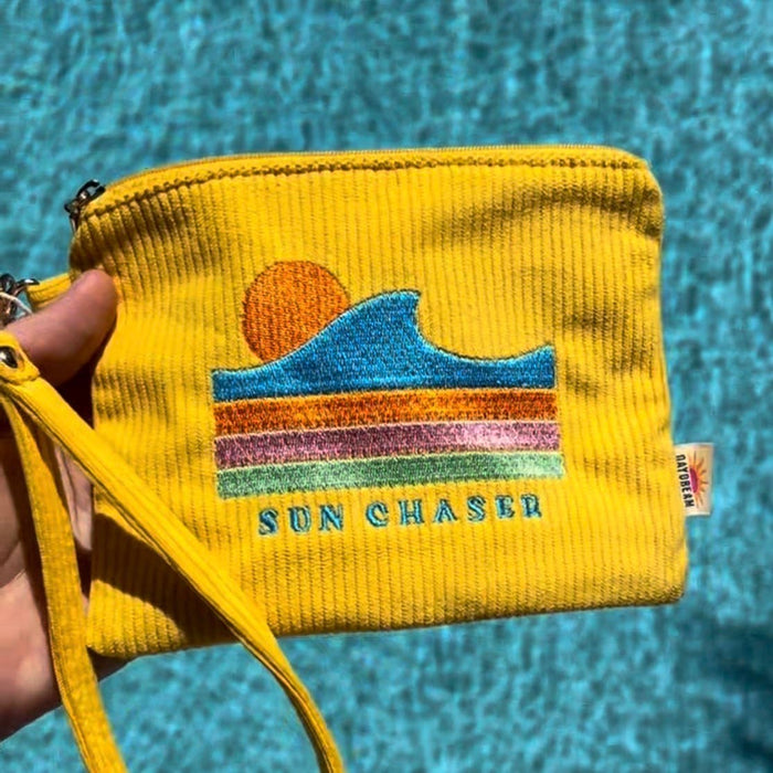 Close-up of retro embroidery detail on soft corduroy wristlet pouch by Daydream Prints