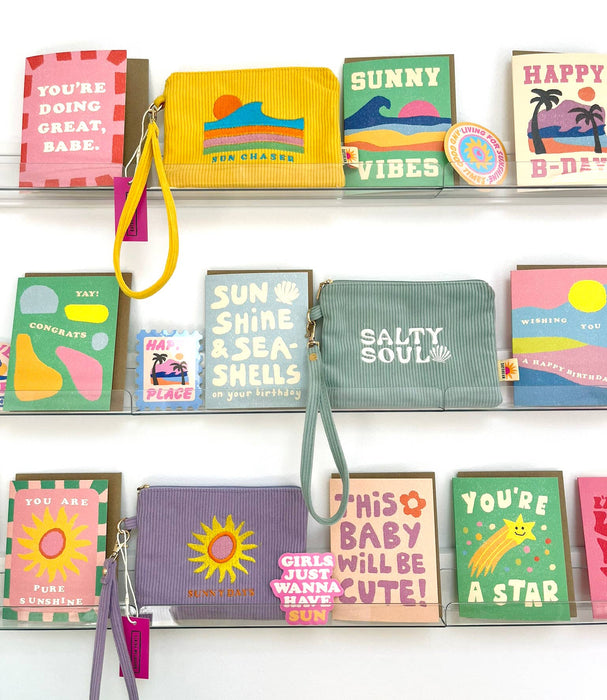 Corduroy zip wristlet pouch with metal zipper and branded Daydream Prints label — coastal summer accessory