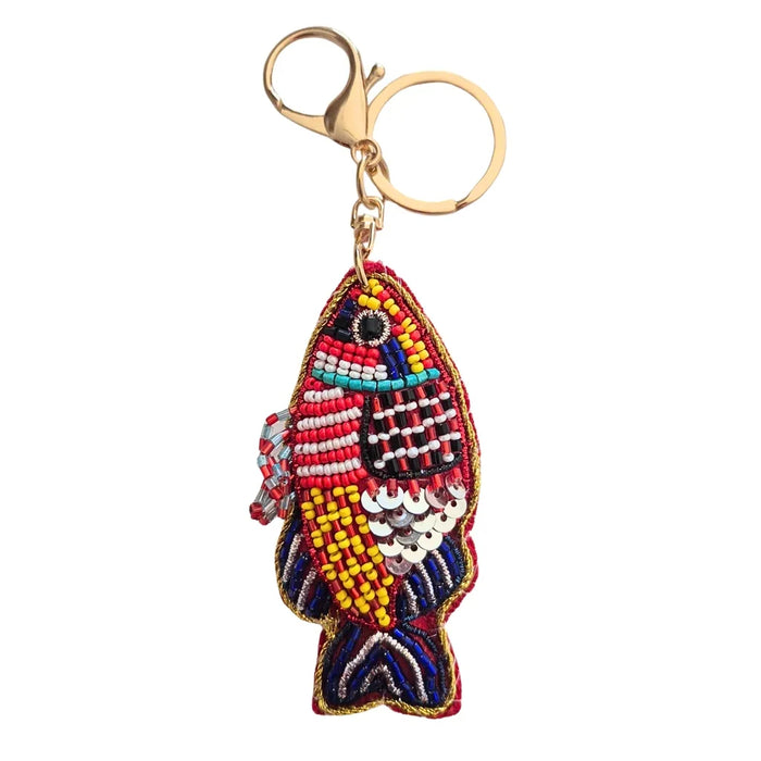 Fish-shaped keychain with multicoloured patterned beadwork, silver-coloured sequin accents, gold-tone edging, keyring and clasp
