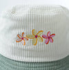 Close-up of embroidered flower detail on Flower Bloom corduroy bucket hat
