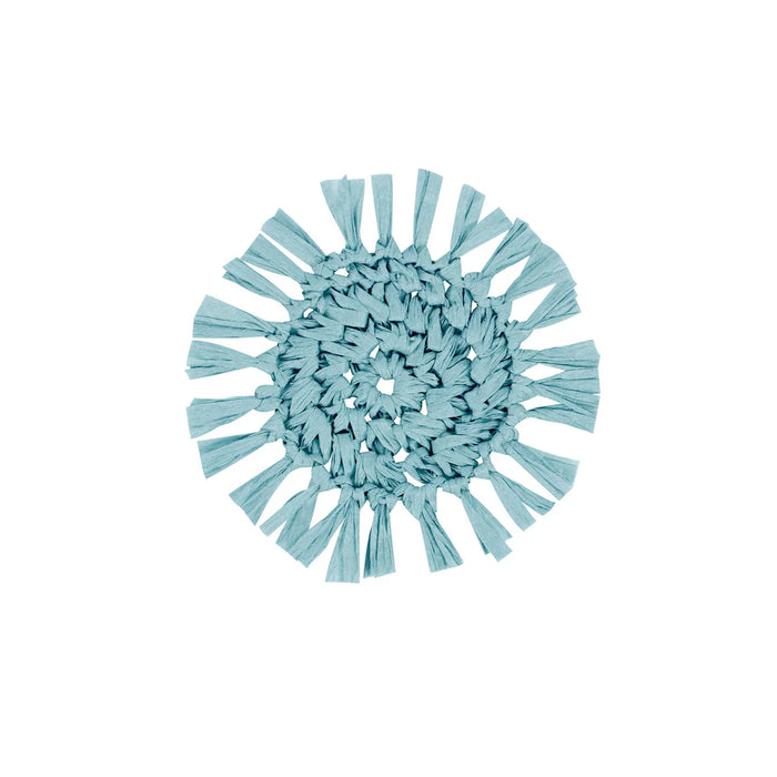 Fringe aqua round paper coaster with textured edge, styled on a coastal table setting