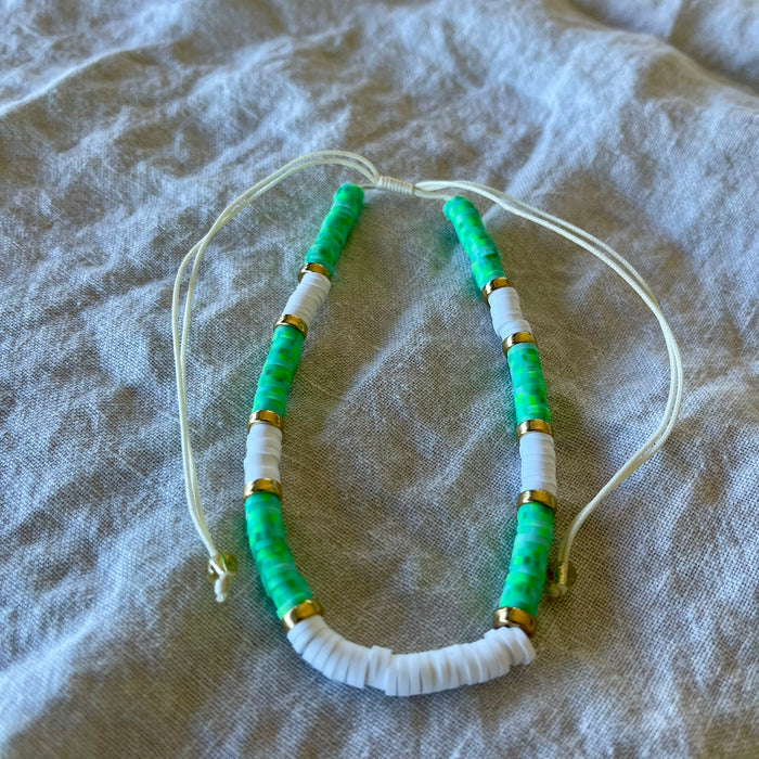 Turquoise polymer clay bead anklet with gold-tone rings and white shell beads on adjustable white cord
