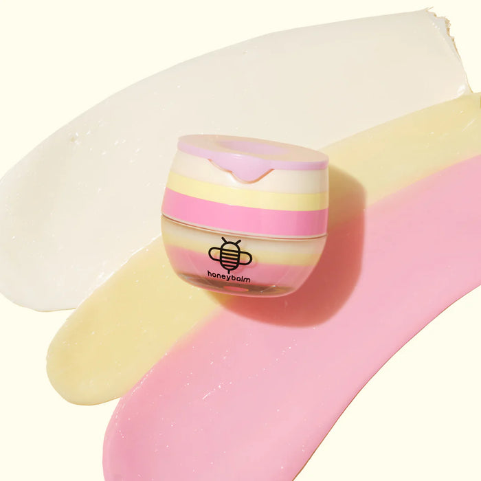 Honeybalm birthday cake lip balm styled flat lay - limited edition gift idea Travel and Tide
