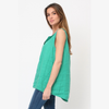 100% linen tank top side view showing relaxed A-line silhouette and curved hem worn by model
