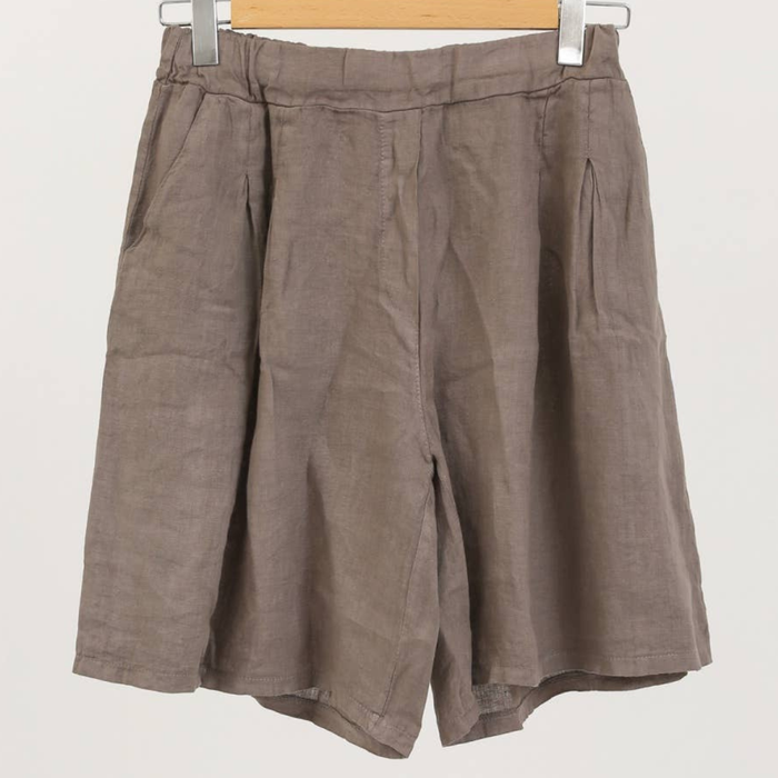 100% linen wide-leg Bermuda shorts in taupe with front pleats and patch pockets on hanger
