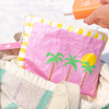 Palm Tree beach pouch laid flat showing coastal palm tree design and crinkled Tyvek texture
