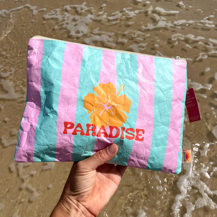 Paradise beach pouch laid flat showing striped hibiscus design and crinkled Tyvek texture
