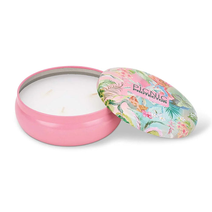 Picnic Protector citronella candle styled on an outdoor picnic table with food and summer entertaining

