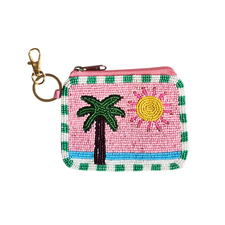 Pink beaded keychain pouch with a green palm tree, yellow sun, blue stripe, green and white striped edging and gold-tone keyring clip
