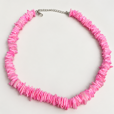 Pink candy puka shell necklace on white background - Travel and Tide
