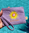 Close-up of Sunny Days sun embroidery detail on soft lavender corduroy wristlet pouch by Daydream Prints
