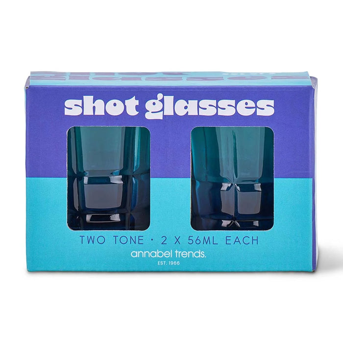 Blue two tone shot glasses styled together on a bar cart for entertaining
